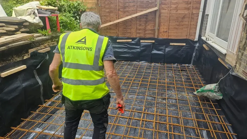 ATKINSONS team laying reinforcement for an extension floor