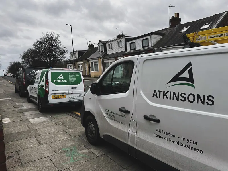 ATKINSONS vans parked on a terraced street in Sunderland