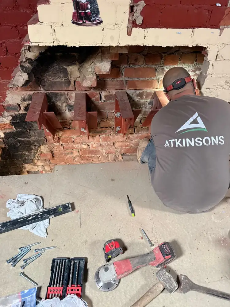 ATKINSONS tradesman working on structural roof work
